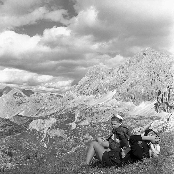 Tourists watching Dolomites landscape after they got Faloria hut C- Old Photo