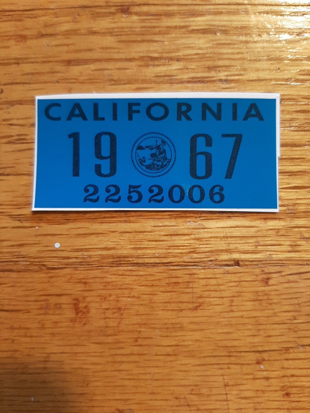 1967 California license plate registration YOM DMV sticker. 1967 California license plate registration YOM DMV sticker.