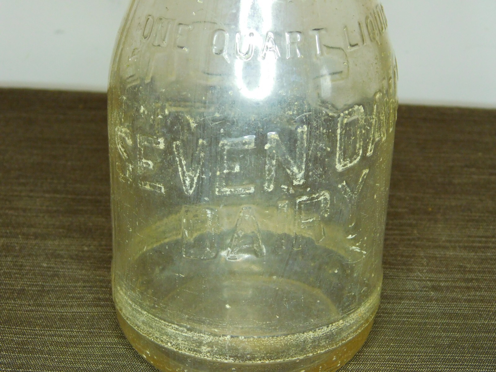 VINTAGE 1 QT MILK BOTTLE SEVEN OAKS DAIRY STORE BOTTLE