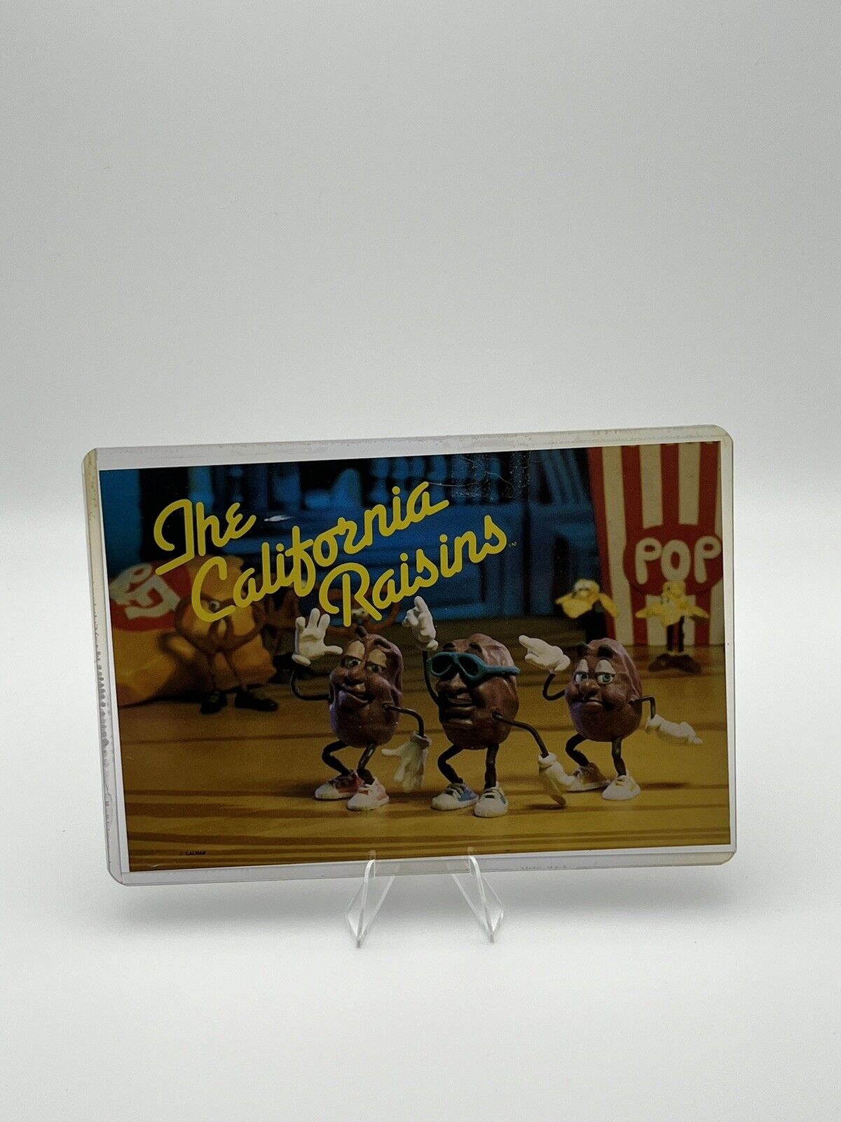 Vintage Funny The California Raisins Postcard Ad In Hard Plastic Holder - Used
