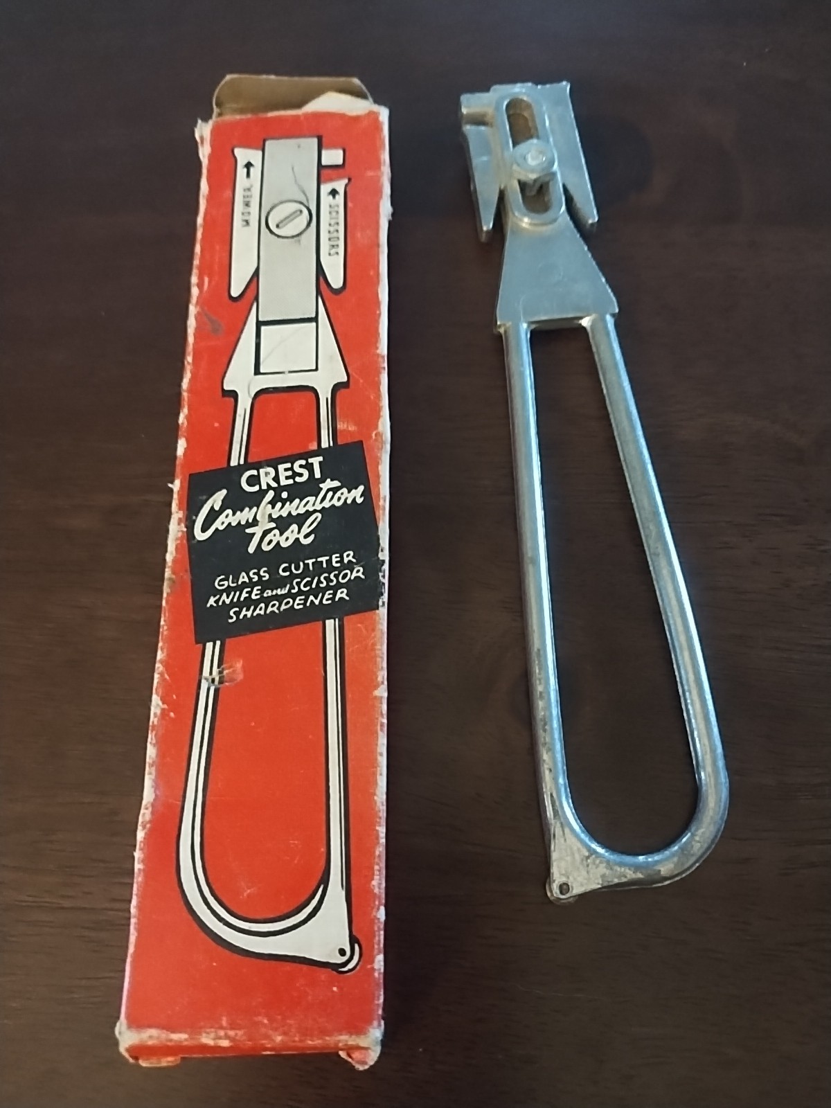 The vintage Crest combination tool, likely dating back to the 1950s or 1960s.