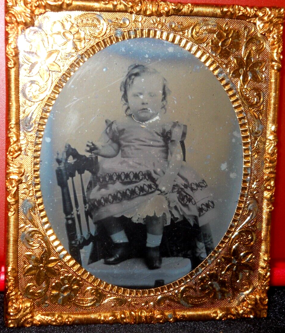 1/6th Size Ambrotype of young child in brass mat/frame