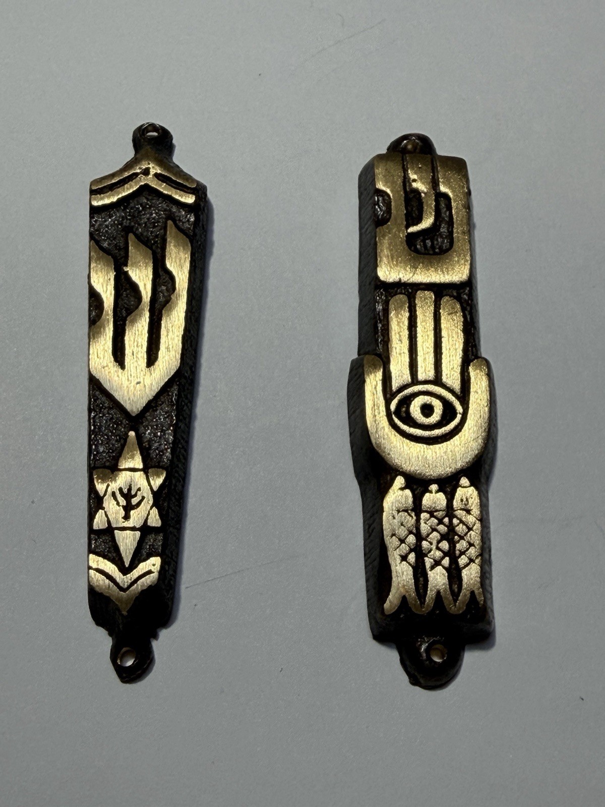 Set Of Two Gold With Bronze Tone Mezuzah Cases. Approximately 3”. Set Of Two Gold With Bronze Tone Mezuzah Cases. Approximately 3”.