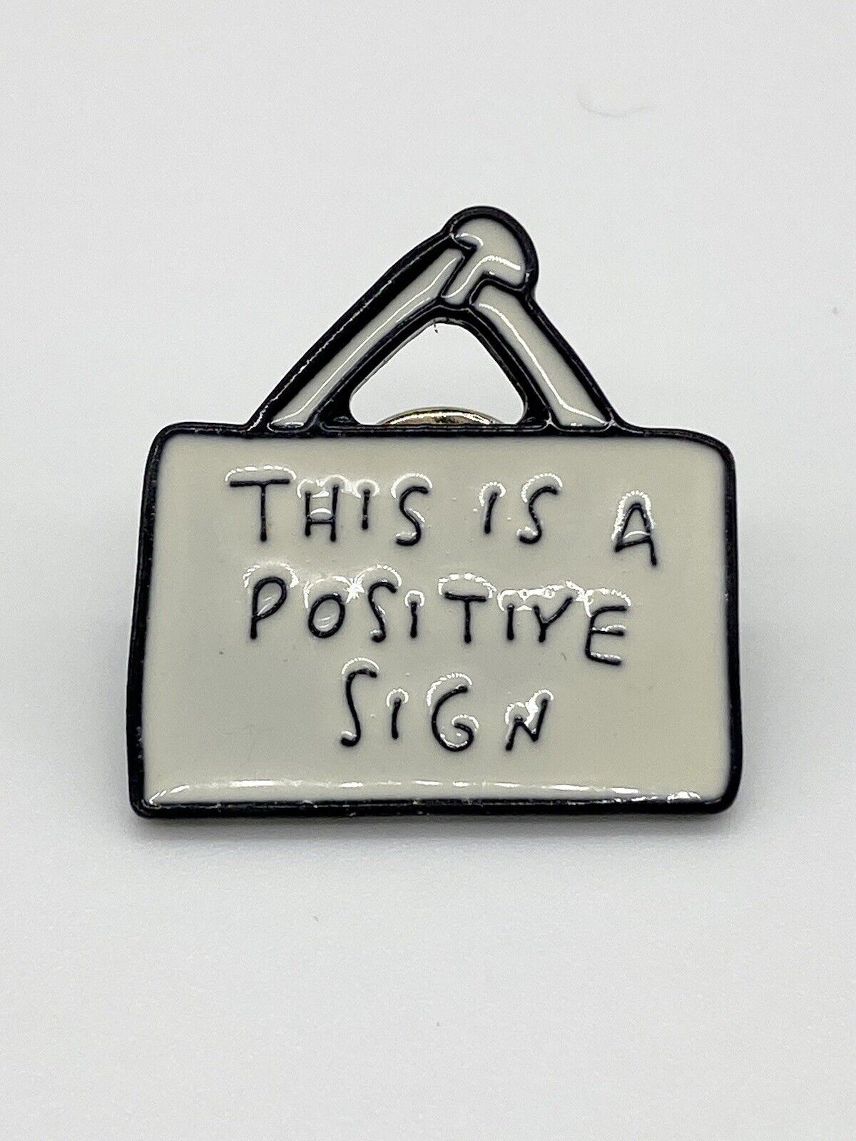 This is a Positive Sign Fun Humor Lapel Pin