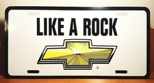Vintage NOS 'Like A Rock' Chevrolet Chevy Bowtie Dealer Metal License Plate picture