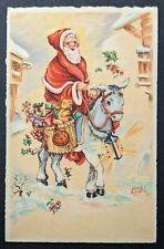 Postcard Vintage Christmas Santa Claus Riding Donkey Mule Toys Snow Town picture