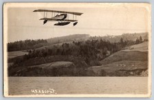 Vintage RPPC WWI Biplane USAS Scout Seaplane Flying Over River Military Aircraft picture