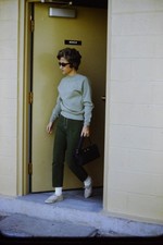 c1960's 35mm Slide, Woman Sunglasses Handbag Pants green black Doorway Sign picture