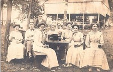 RPPC Young Women in White Dresses Sitting in Park Drinking Beer early 1900s picture