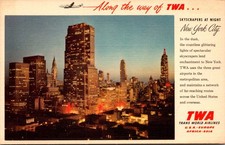 Vintage TWA New York City Skyscrapers at Night Airline Advertising Postcard picture