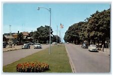 c1960 Sun-Drenched Area West Ludington Avenue Classic Cars Michigan MI Postcard picture