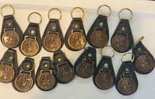 Lot of 14 Vintage Nigerian Army Souvenir Brass Medallion Leather Keychains picture