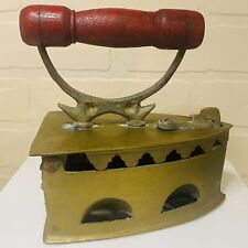 Antique heavy brass cast iron coal iron with red wood handle picture
