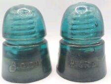 Pair Of Antique Green Glass H. G. Co. Insulators picture