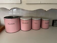 vintage pink metal canisters picture