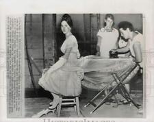 1965 Press Photo Geraldine Chaplin smiles for the camera while costume pressed picture