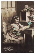 1910 RPPC REAL PHOTO NEW YEAR FRENCH GIRL READS LETTER TO HER DOLL HAND COLORED picture