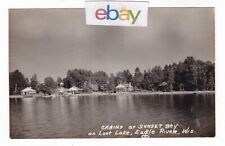 1951 RPPC EAGLE RIVER WISCONSIN LOST LAKE SUNSET BAY RUSTIC CABINS CARS POSTCARD picture