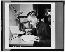 Photo:Man Writing at Desk 1900s Study Lamp Books Black and White Photo picture