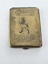 Johnnie Walker Rare Brass Metal Matchbook Cover  “Born 1920 Still Going Strong” picture