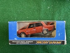 vintage 1:43 scale model of a Soviet-era red Lada (VAZ-2105 / Zhiguli) picture